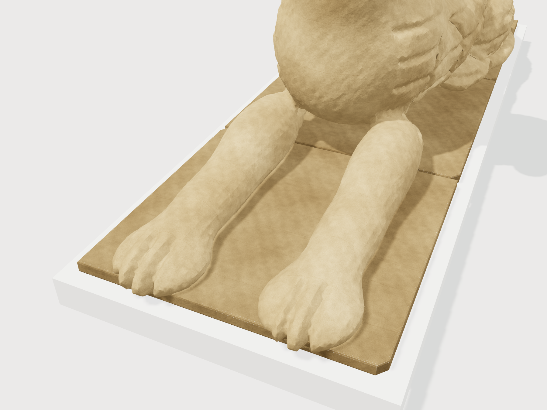 Detail of the lion paws with carved toe separations and stone block joints